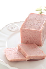 Sliced luncheon meat on dish