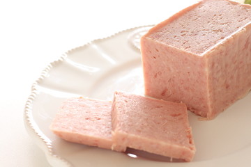 Sliced luncheon meat on dish