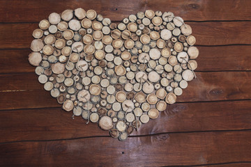 Decoration of the hall in the form of wooden stumps heart. Backgrounds