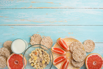 Grapefruit, muesli and bread. View from above, with an empty place for the inscription. The concept of a diet