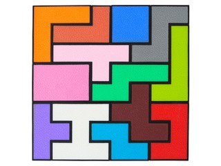 Wooden puzzle on white