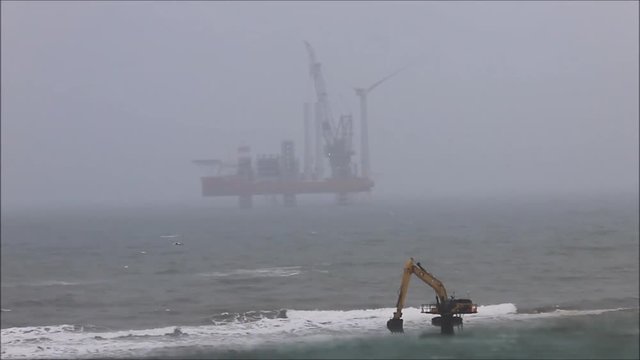 Wind turbine's installing in waters off the coast of Aberdeen, Balmedie, Aberdeenshire, Scotland, UK. April 10th 2018