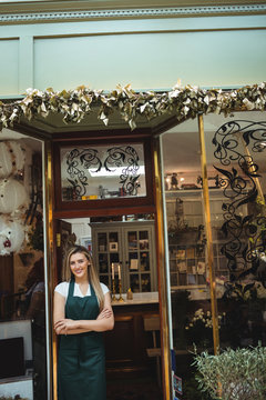 Female florist standing at the entrance