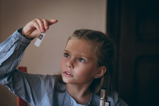 Girl experimenting microscope slide at home