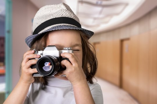 Child with camera.