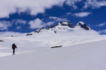 Fototapeta na wymiar Scene view of mountain skier against Mount Tronador in Pampa Linda, Nahuel Huapi National Park, Bariloche, Patagonia, Argentina