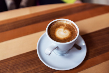 Cappuccino On Wooden Table Closeup View