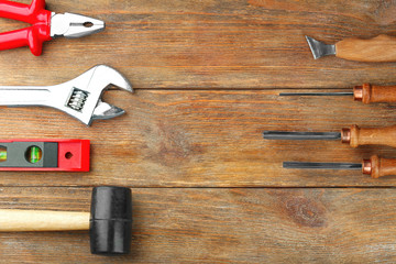 Set of tools on wooden background