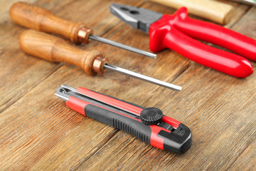 Set of carpenter's tools on wooden background