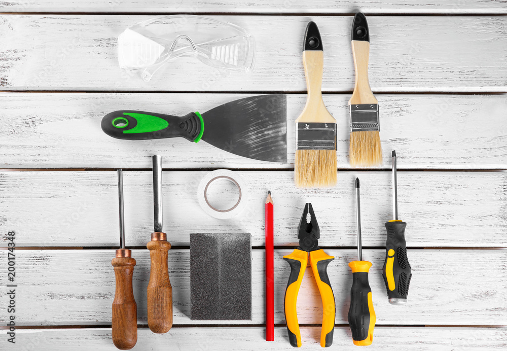 Wall mural set of carpenter's tools on wooden background