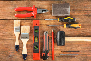 Set of tools on wooden background