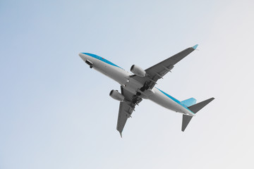 flying airplane in blue sky