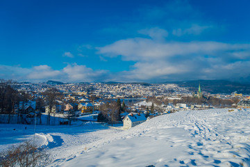 Gorgeous aerial view of the norwegian city with buildings in the horizont in Trondheim during the winter
