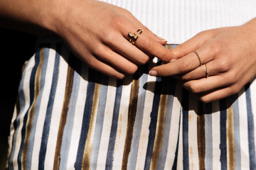 Crop woman hands with rings on the street