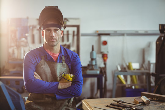 Portrait of male worker standing in workshop