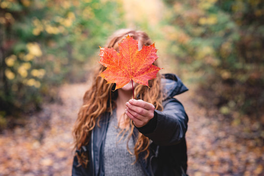 Woman showing maple leaf