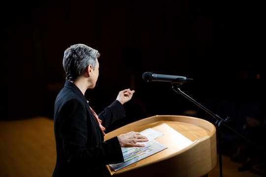 Female business executive giving a speech