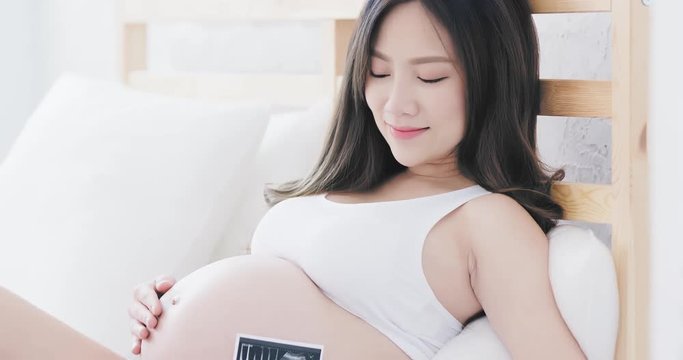 woman holding baby ultrasound