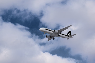 Fototapeta na wymiar Airplane with black stripe