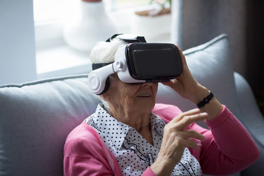 Senior woman using virtual reality headset