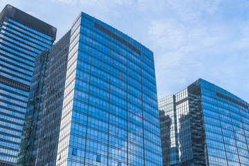 Fototapeta na wymiar Modern office building against blue sky.
