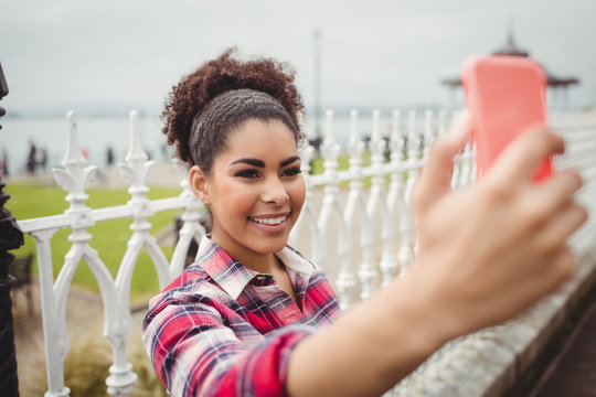 Smiling woman taking selfie 
