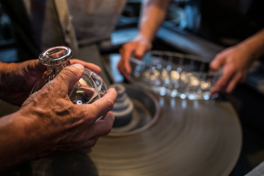 Glassblowers working on a glass