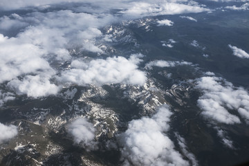 Clouds above of white mountains