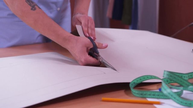 woman designer maiking new dress template