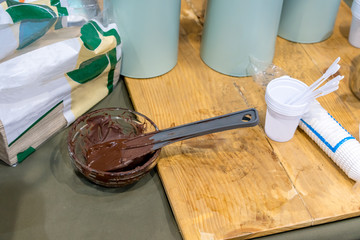 Behind counter of food sample preparation with harden chocolate sauce after cooled