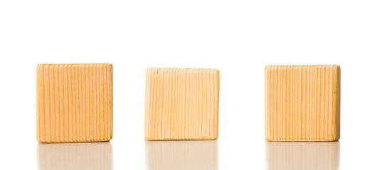 3 wooden cubes on white background