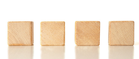 4 wooden cubes on white background