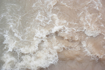 stormy clayey water in a river