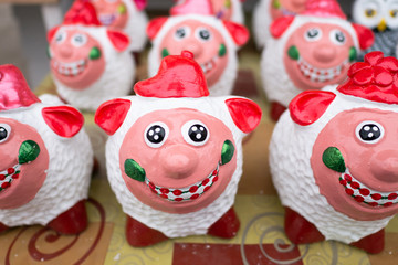 Sheep plaster wears a red hat