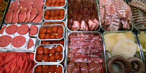 Variety of marinated meat at display counter
