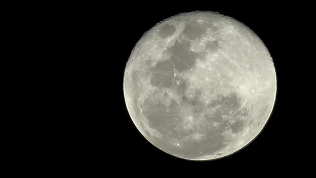 movement of full moon in night sky