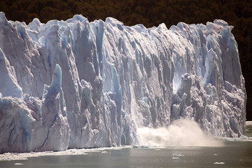 Piece of ice collapses as the Perito Moreno Glacier advances in the Los Glaciares National Park, Patagonia, Argentina
