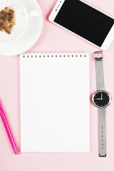 Fototapeta na wymiar Concept morning planning - cappuccino, notebook, pen, phone, watch on pink background. Top view, copy space