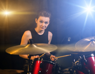 Young woman at drumset