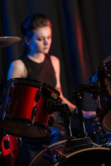 Fototapeta na wymiar Female at drumset
