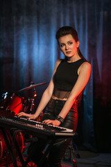 Obraz na płótnie Canvas Musician plays keyboards on stage