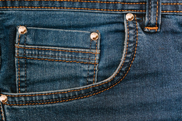 Pocket on blue jeans. Fashion background. Jeans texture