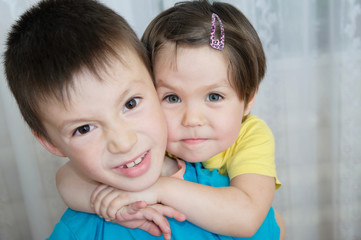 animosity between brother and sister. siblings children portrait - boy and little girl, together....