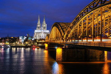 Fototapeta premium Cologne Cathedral and Hohenzollern Bridge at Twilight Time in Cologne, Germany