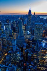 New York City skyline at night - skyscrapers of midtown Manhattan with Empire State Building at...