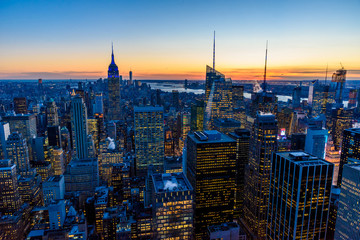 New York City skyline at night - skyscrapers of midtown Manhattan with Empire State Building at Amazing Sunset - USA - obrazy, fototapety, plakaty