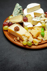 Cheese plate with Assorted cheeses Camembert, Brie, Parmesan blue cheese, goat