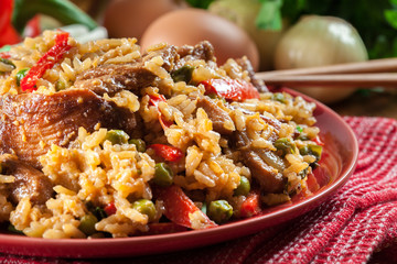 Fried rice with chicken and vegetables served on a plate