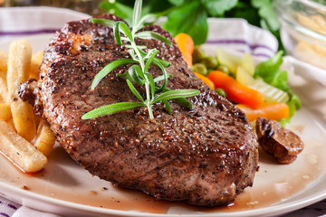 Beef steak served with baked potatoes - 200206331