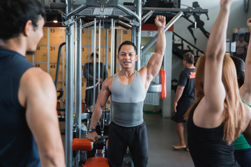 Fototapeta na wymiar Asian man warm up shoulders for working out